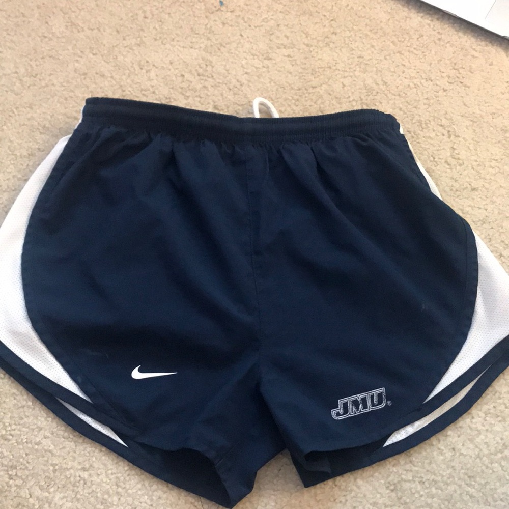 Nike running shorts with JMU sign.
